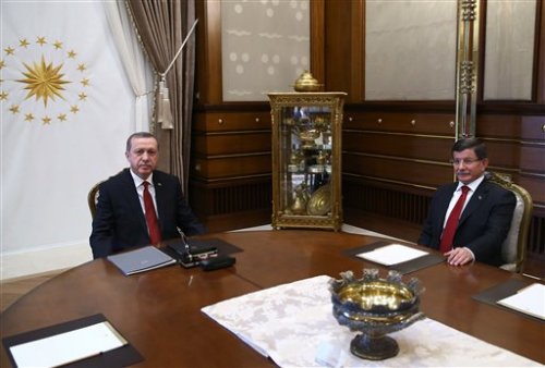 Turkish President Recep Tayyip Erdogan, left, and Prime Minister Ahmet Davutoglu attend a meeting at the presidential palace in Ankara, Turkey, Tuesday, Nov. 24, 2015.