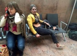 Broken windows seen at the scene of explosions at Zaventem airport near Brussels, Belgium