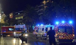 French police and rescue forces vehicles are seen on the Promenade des Anglais July 15, 2016 after at least 60 people were killed in Nice, France, when a truck ran into a crowd celebrating the Bastille Day national holiday July 14.