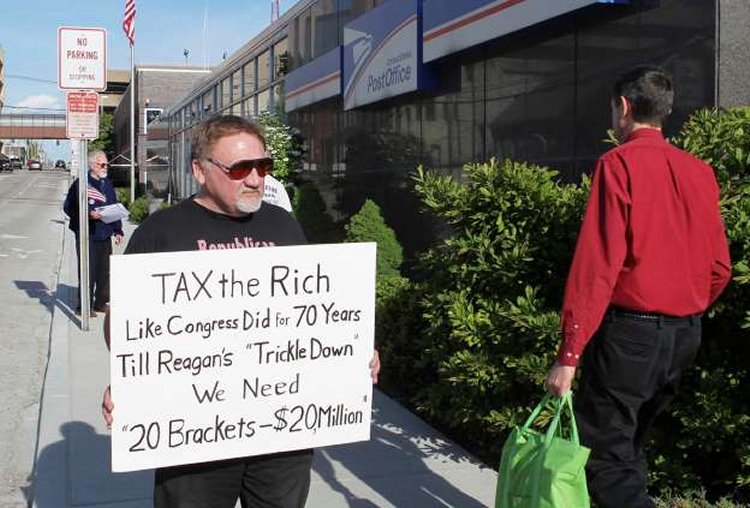  Derik Holtmann/Belleville News-Democrat/AP In this April 17, 2012, photo, James Hodgkinson of Belleville protests outside of the United States Post Office in Downtown Belleville, Ill. A government official says the suspect in the Virginia shooting that injured Rep. Steve Scalise and several others has been identified as Hodgkinson.