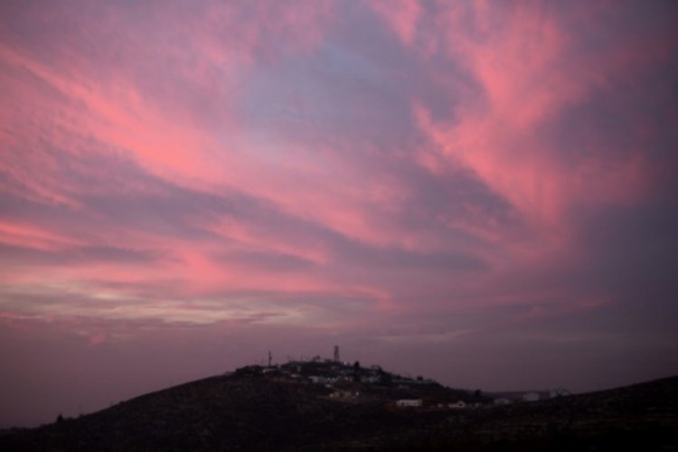 The Knesset will vote on whether to legalize Jewish wildcat settlements in the West Bank, such as the Achiya outpost which was built near the Palestinian village of Jalud [AFP / MENAHEM KAHANA]