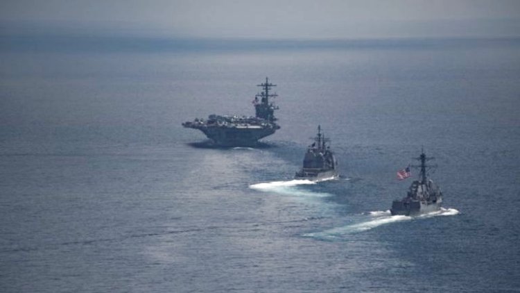 The USS Carl Vinson (left) and other warships were in the Indian Ocean over the weekend