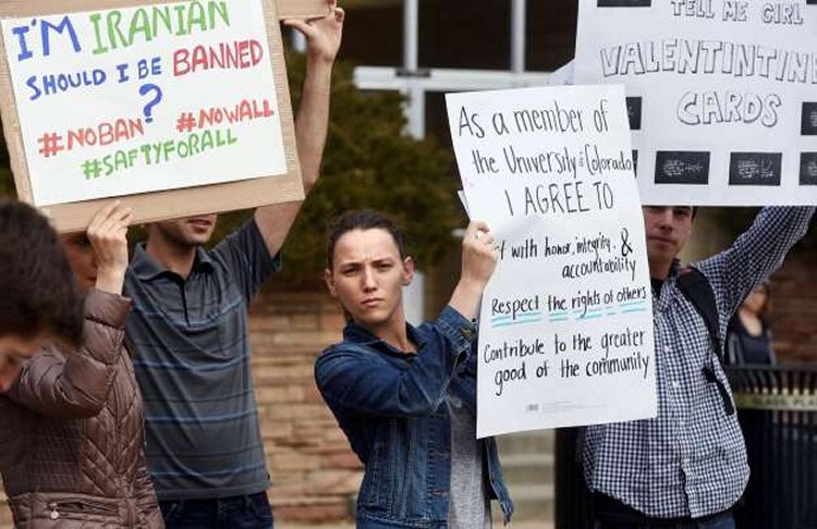 Allie Morgan, a University of Colorado graduate student, is among dozens of people at a travel ban protest at the University of Colorado in Boulder on Thursday, Feb. 9, 2017. � Cliff Grassmick/Daily Camera via AP