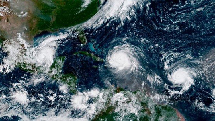 Hurricane Irma, center, with Hurricane Katia in the Gulf of Mexico, left, and Hurricane Jose in the Atlantic Ocean, right.  (NOAA via AP)