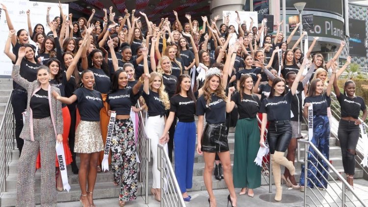 Miss Universe Iris Mittenaere and the Miss Universe contestants pose for photos in #VegasStrong shirts at a welcome event in Las Vegas, Nevada on November 16, 2017. Gabe Ginsberg/Getty Images for Planet Hollywood Intl.