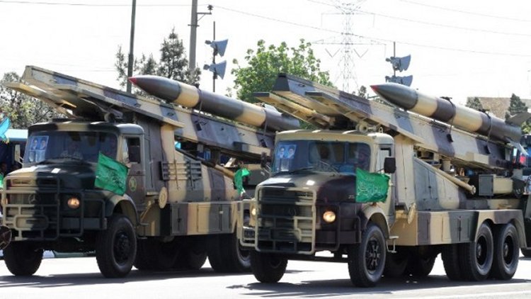 Iranian military trucks carry surface-to-air missiles during a parade on the occasion of the country's Army Day, on April 18, 2017, in Tehran. (AFP Photo/Atta Kenare)