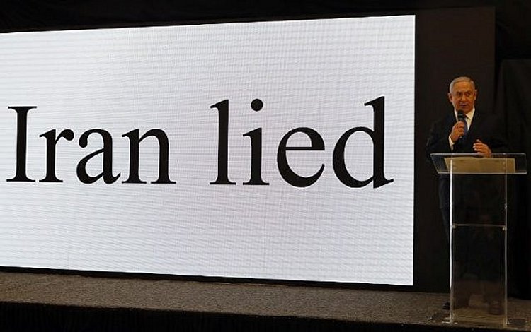 Prime Minister Benjamin Netanyahu gives a speech on files obtained by Israel he says proves Iran lied about its nuclear program, at the Defense Ministry in Tel Aviv, on April 30, 2018. (AFP Photo/Jack Guez)