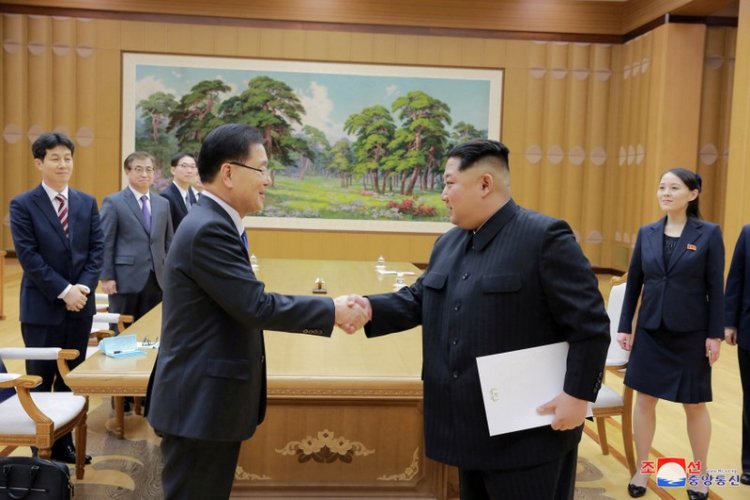 North Korean leader Kim Jong Un shakes hands with Chung Eui-yong who is leading a special delegation of South Korea's President, in this photo released by North Korea's Korean Central News Agency (KCNA) on March 6, 2018. KCNA/via Reuters