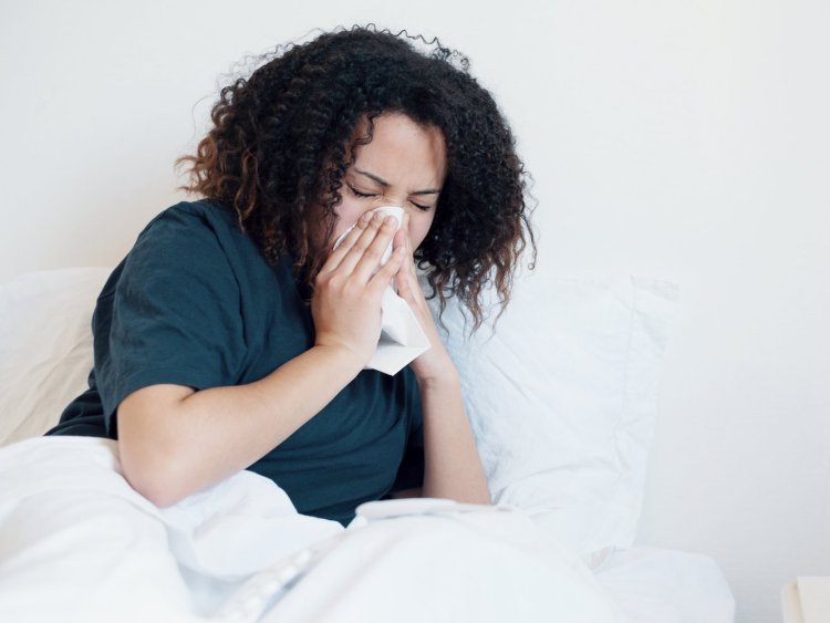 Sneezing girl with the flu