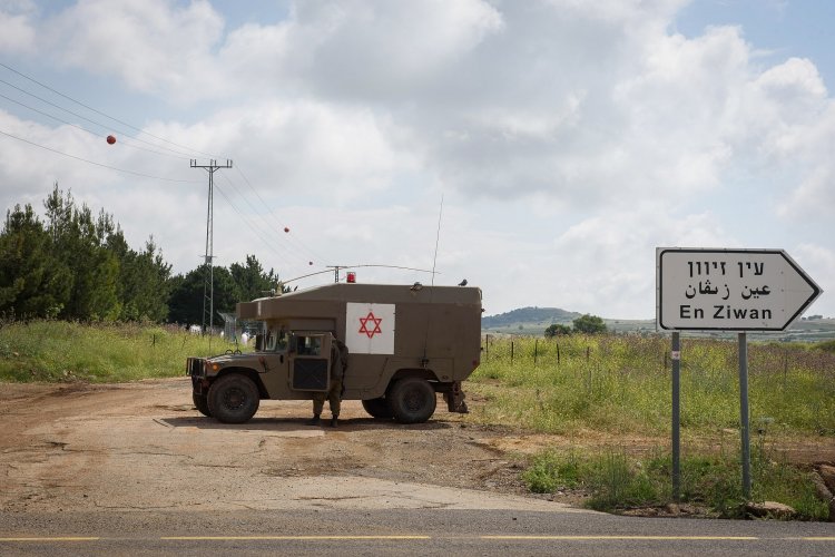 Israeli soldiers seen near the Israeli-Syrian border in the Golan Heights on May 9, 2018. (Basel Awidat/Flash90)