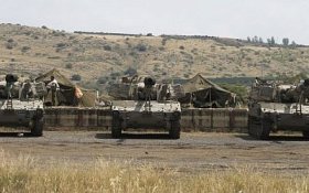 An Israeli artillery unit takes position near the Syrian border on the Golan Heights on May 9, 2018. (Jalaa Marey/AFP)